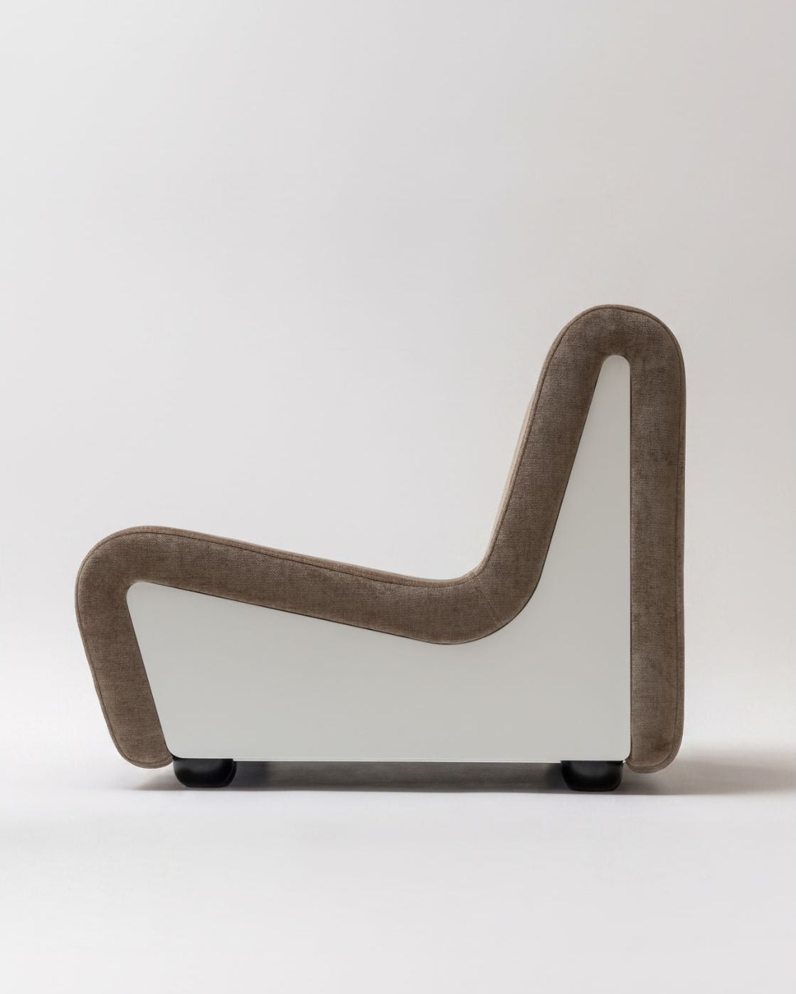 Dialogue lounge chair in Clay gray fabric and white lacquered wood side panels, side view 