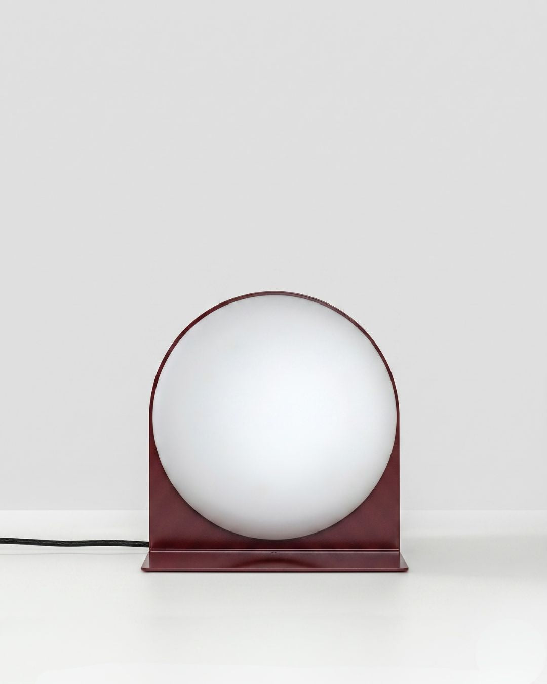 Red Jumelles lamp table version, slightly angled view, unlit