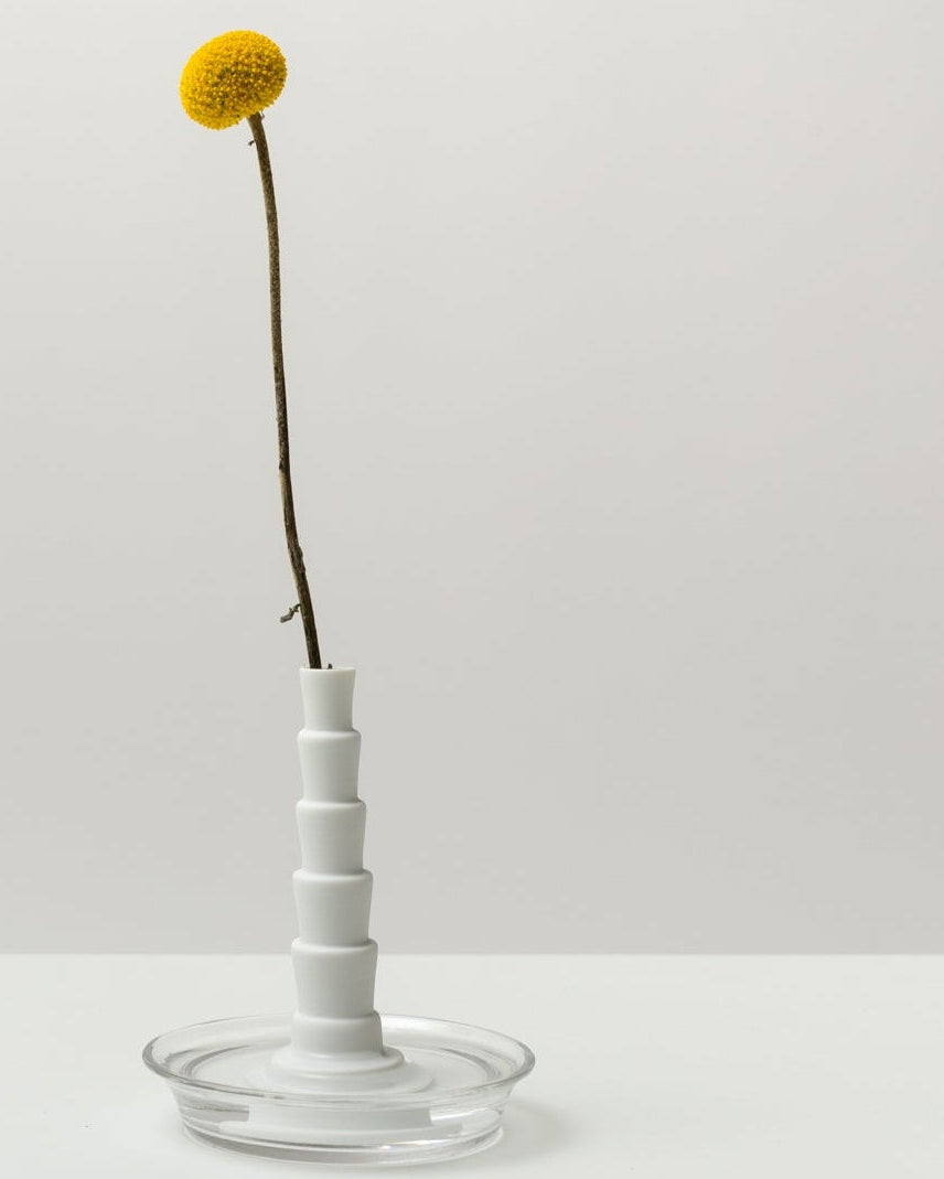 Miniflore No.2, unglazed porcelain minimalist vase with flower, in a glass holder 