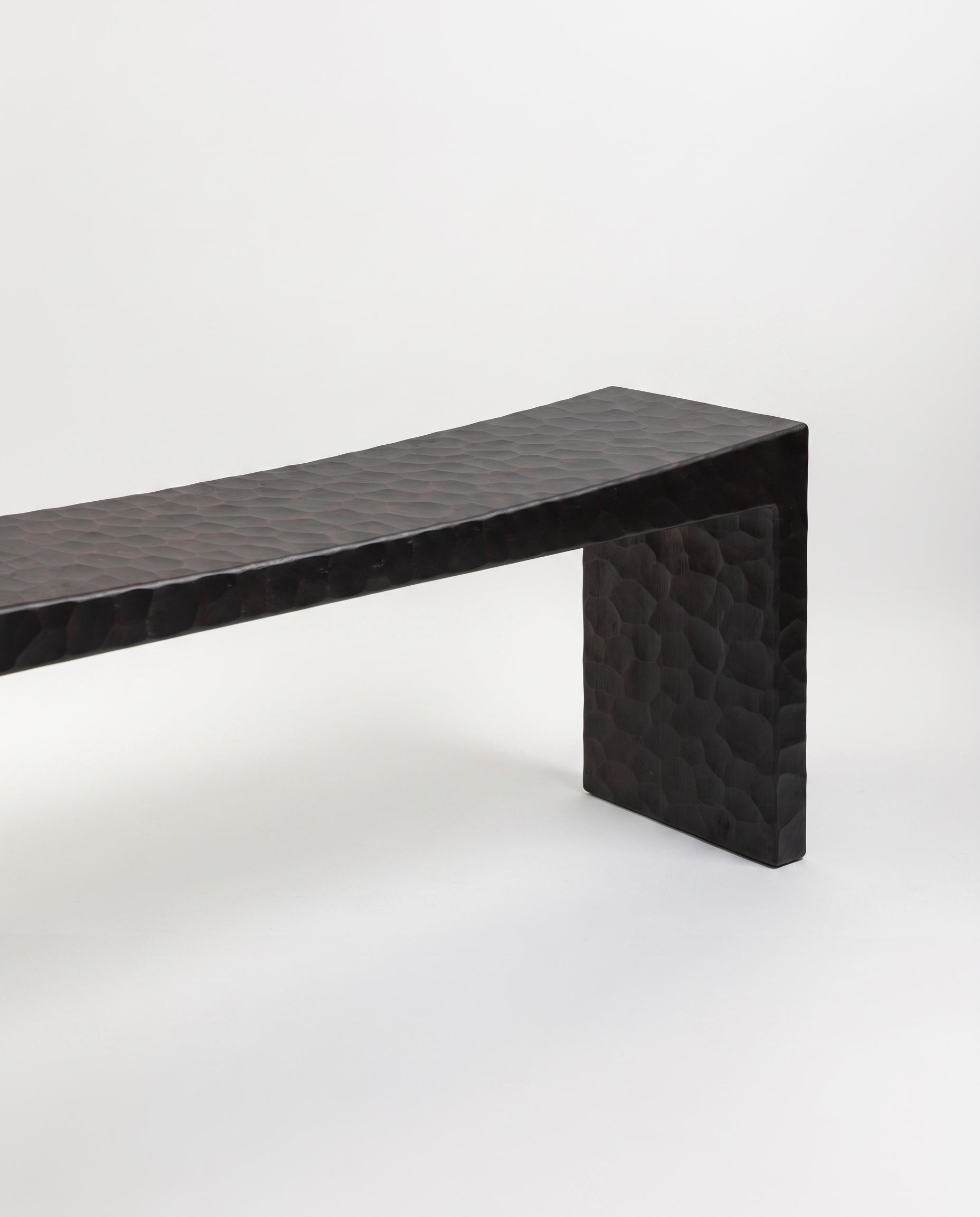 Detail of gouged ebony finish – Basilio bench by Giuseppe Rivadossi
