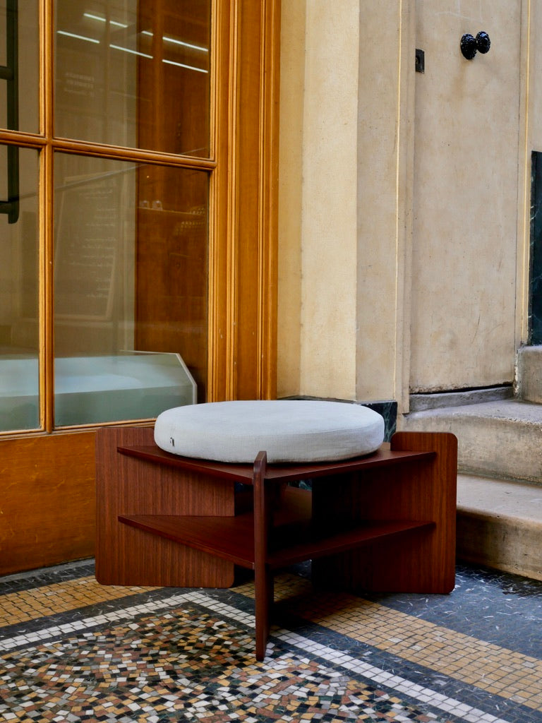 TU-TU side table, walnut veneer, topped with an Arctic Blue seat cushion, to use as a pouf,  in Galerie Vivienne in Paris 