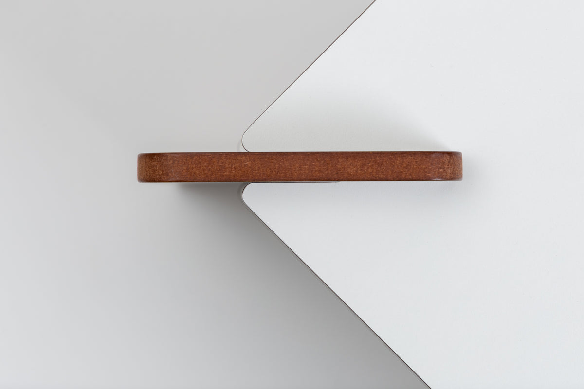 Detail top view of the TU-TU side table in white laminate with vertical panels in varnished walnut veneer