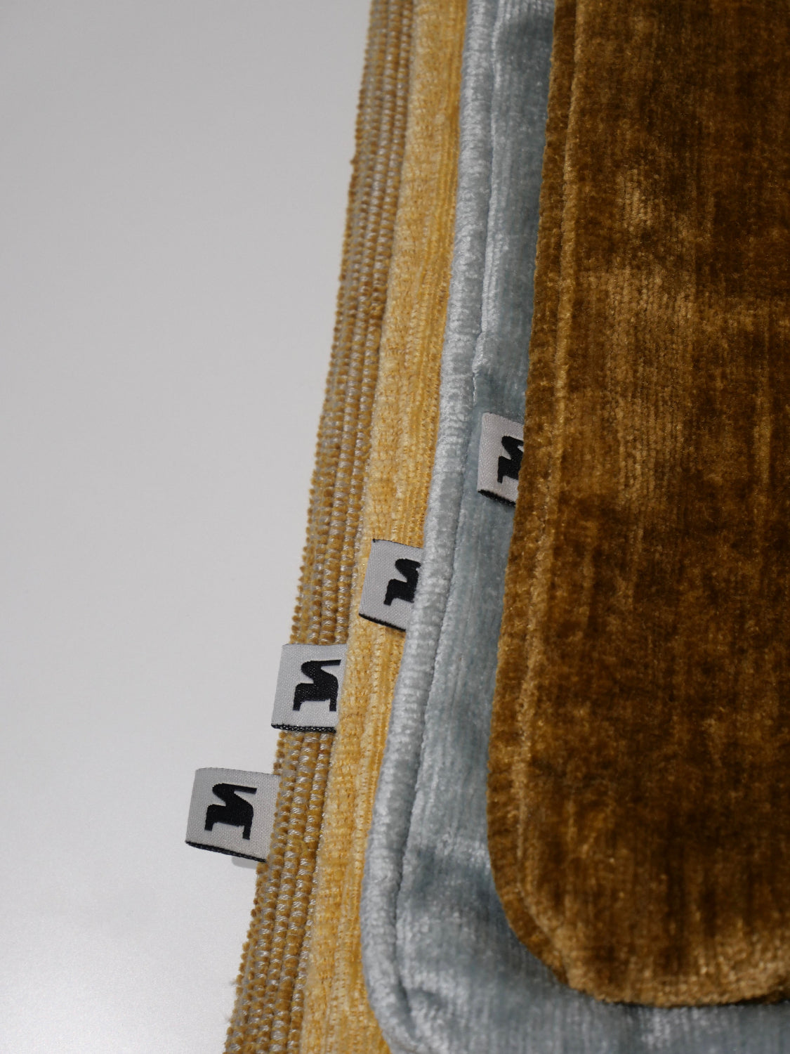 Detail of the edges and textures of the decorative cushions in Italian fabric