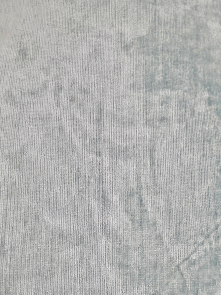 Texture of the glacier blue Italian fabric used for the decorative cushion
