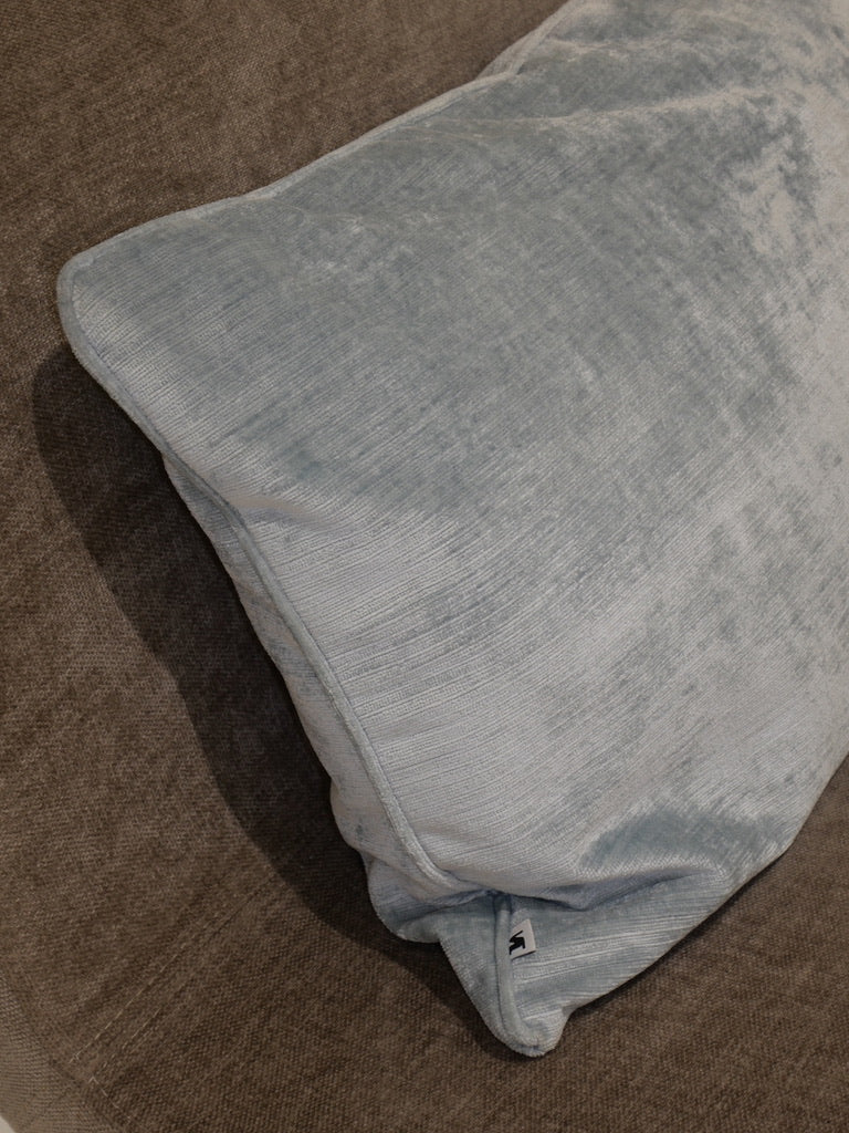 Top view of the glacier blue decorative cushion in velvety Italian fabric